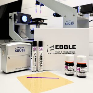 Dyne testing using test inks, dyne markers and contact angle